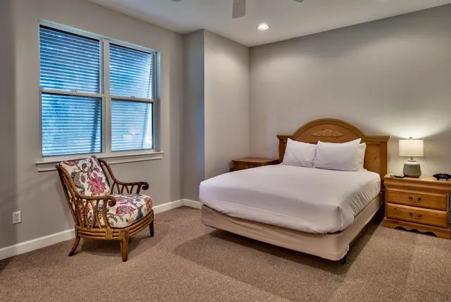 a bedroom with a bed and window