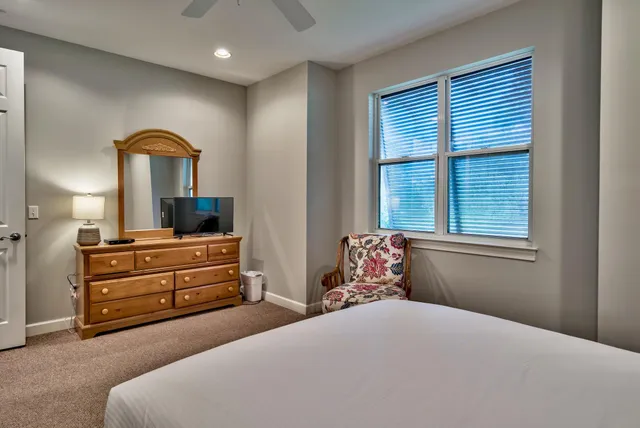 a bedroom with a bed and a dresser