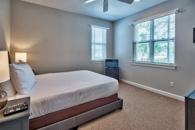 a bedroom with a bed and window