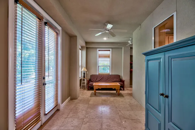 a view of a livingroom with furniture and windows