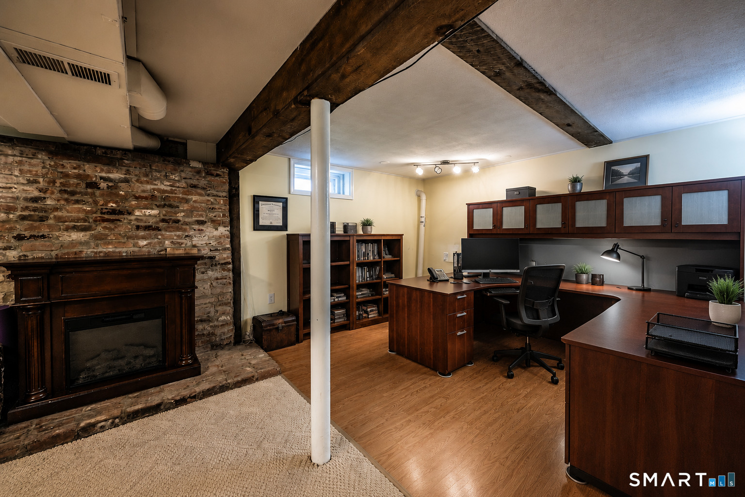 193 R Blue Hills Road Durham, CT 06422 - Photo 21 of 30 a room with furniture a flat screen tv and a fireplace