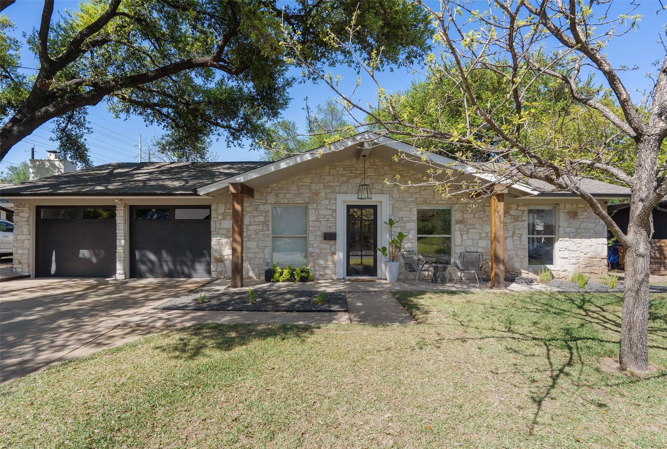 a front view of a house with yard outdoor seating and barbeque oven