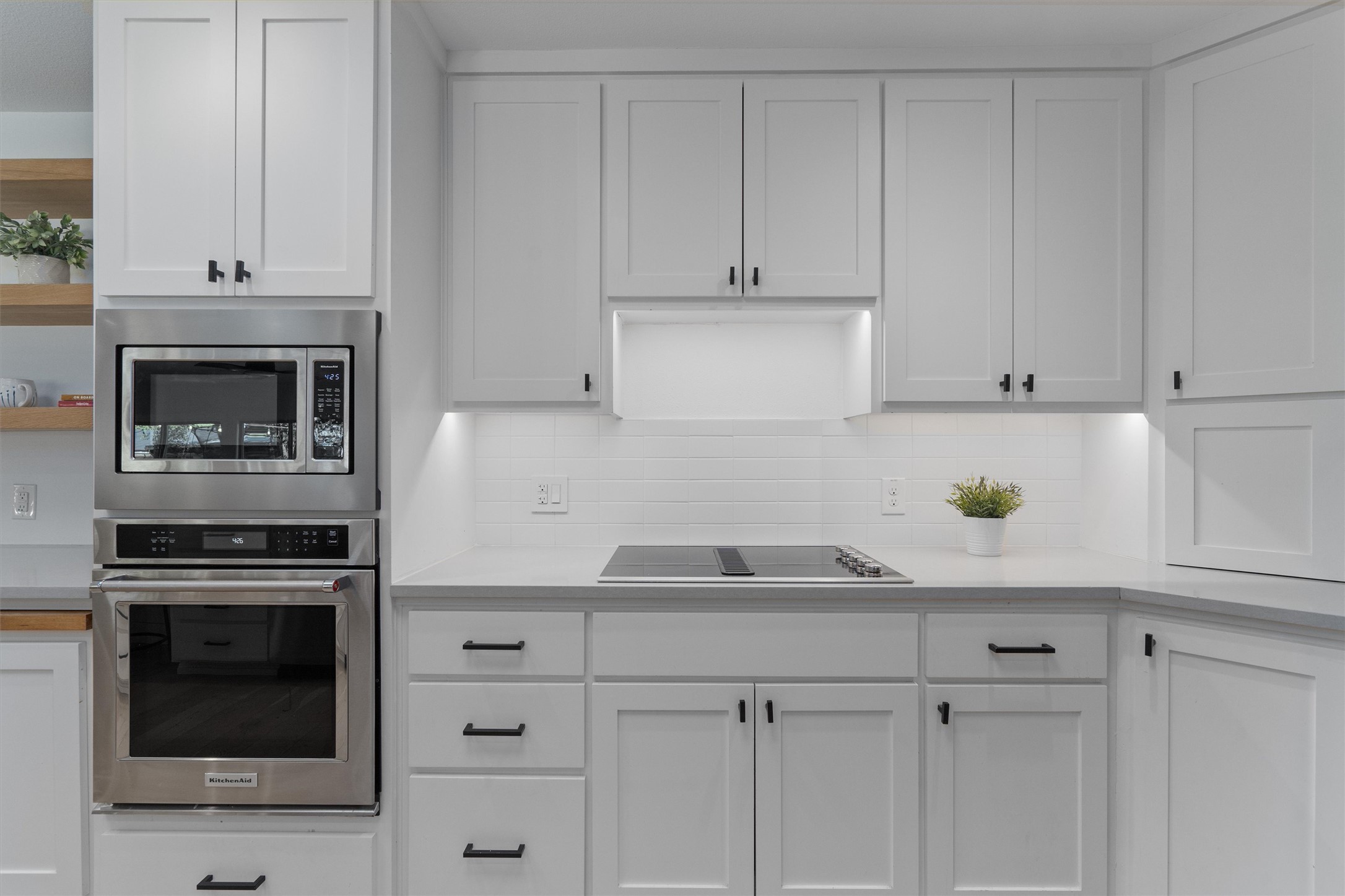 3306 Whiteway Drive Austin, TX 78757 - Photo 10 of 24 a kitchen with white cabinets and appliances