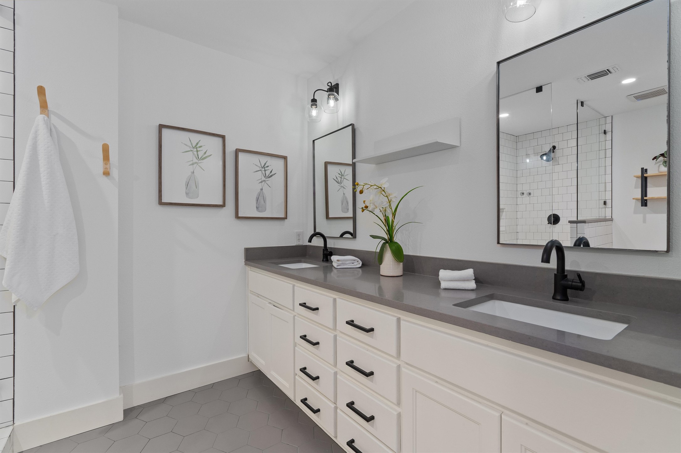 3306 Whiteway Drive Austin, TX 78757 - Photo 13 of 24 a bathroom with double sink and a mirror