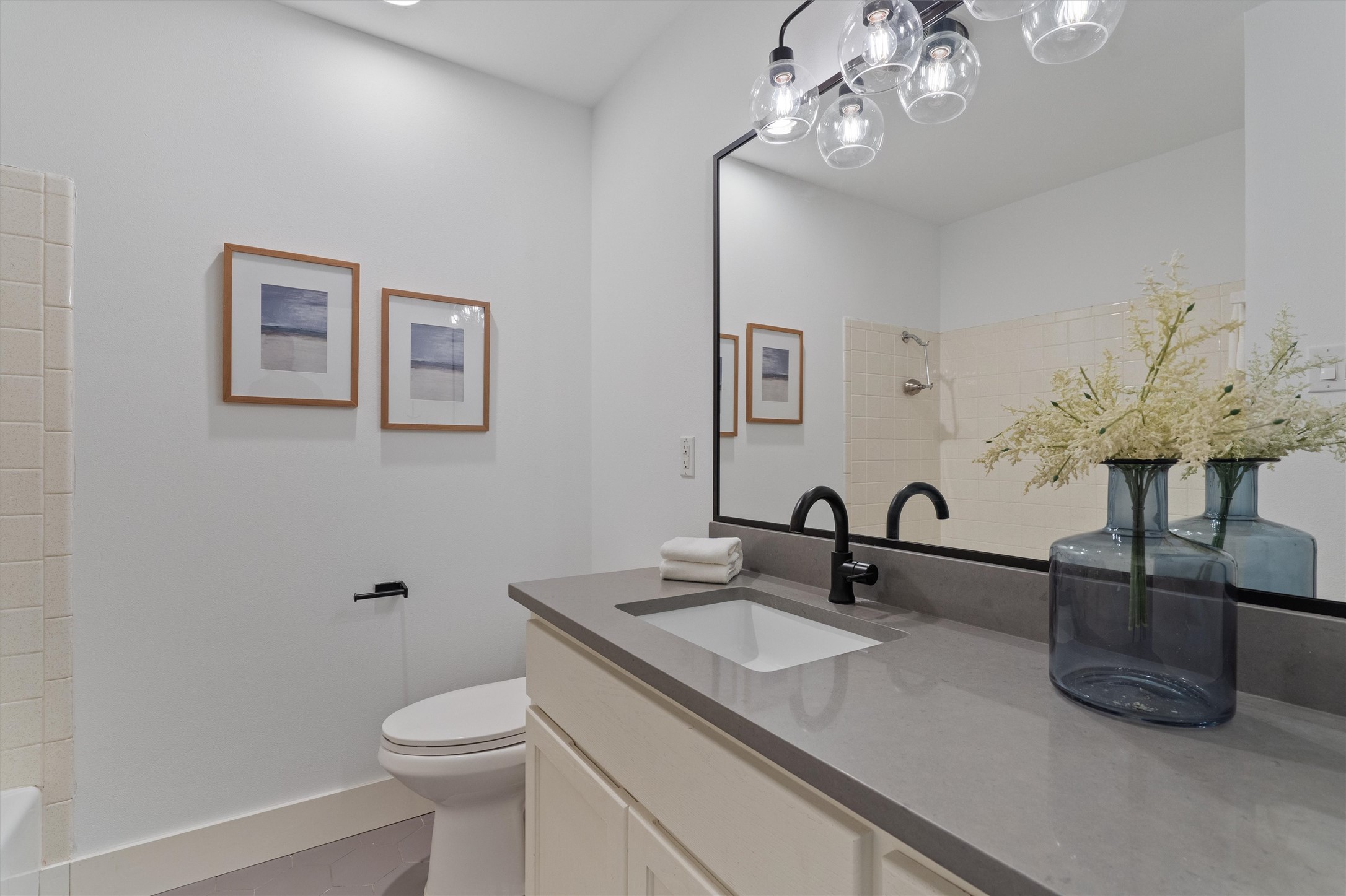 3306 Whiteway Drive Austin, TX 78757 - Photo 19 of 24 a bathroom with a sink a toilet and mirror