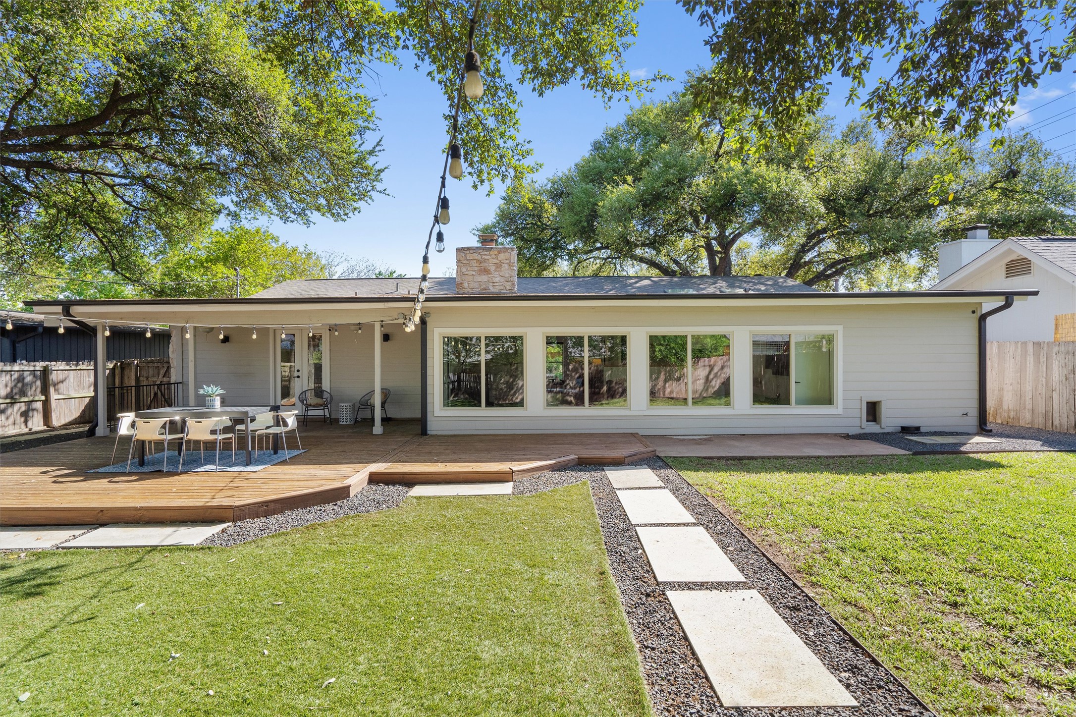 3306 Whiteway Drive Austin, TX 78757 - Photo 5 of 24 front view of a house with swimming pool and a yard