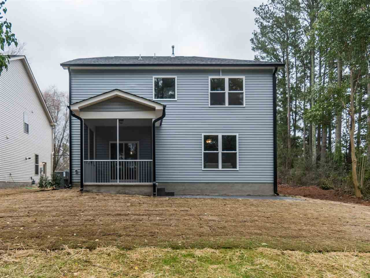 512 Jones Franklin Road Raleigh, NC 27606 - Photo 21 of 23 BACKYARD WITH STAMPED CONCRETE PORCH