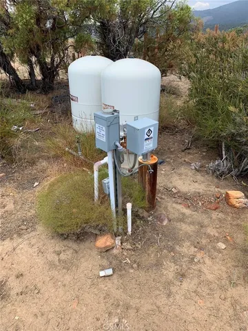 a view of a tiny house with a yard