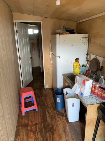 a room with furniture and wooden floor