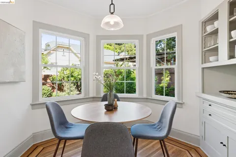 a view of a dining room with furniture window and outside view