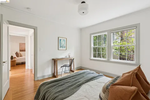 a bedroom with bed and a window