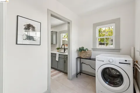 a view of a hallway with washer and dryer