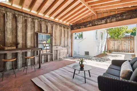 a view of a dining table with a flower pot