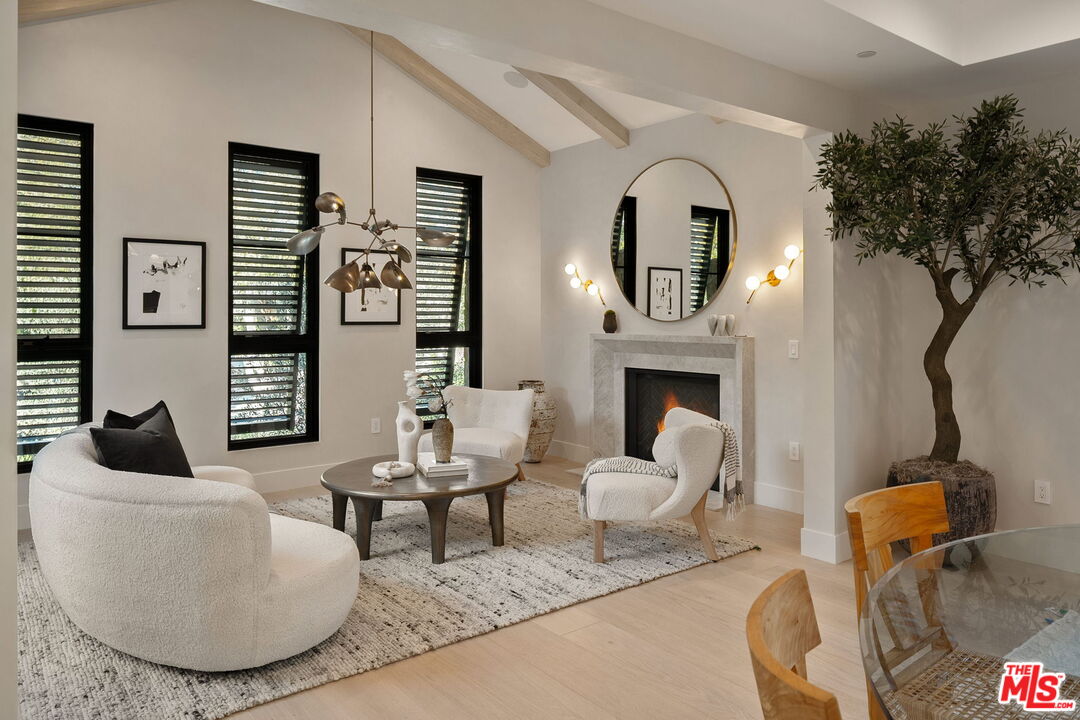 10444 Charing Cross Road Los Angeles, CA 90024 - Photo 20 of 74 a living room with furniture and a fireplace