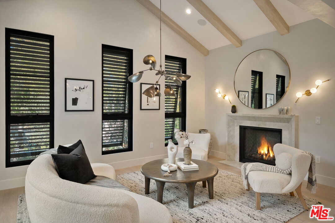 10444 Charing Cross Road Los Angeles, CA 90024 - Photo 21 of 74 a living room with furniture and a fireplace