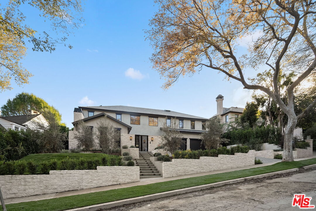 10444 Charing Cross Road Los Angeles, CA 90024 - Photo 3 of 74 a front view of a house with garden and trees