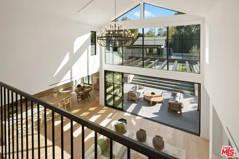 a living room with lots of furniture and a flat screen tv