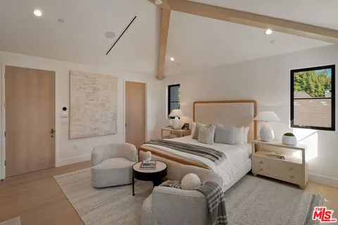 a dining room with stainless steel appliances kitchen island a table and chairs