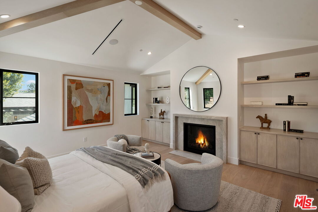 10444 Charing Cross Road Los Angeles, CA 90024 - Photo 34 of 74 a living room with furniture and a fireplace