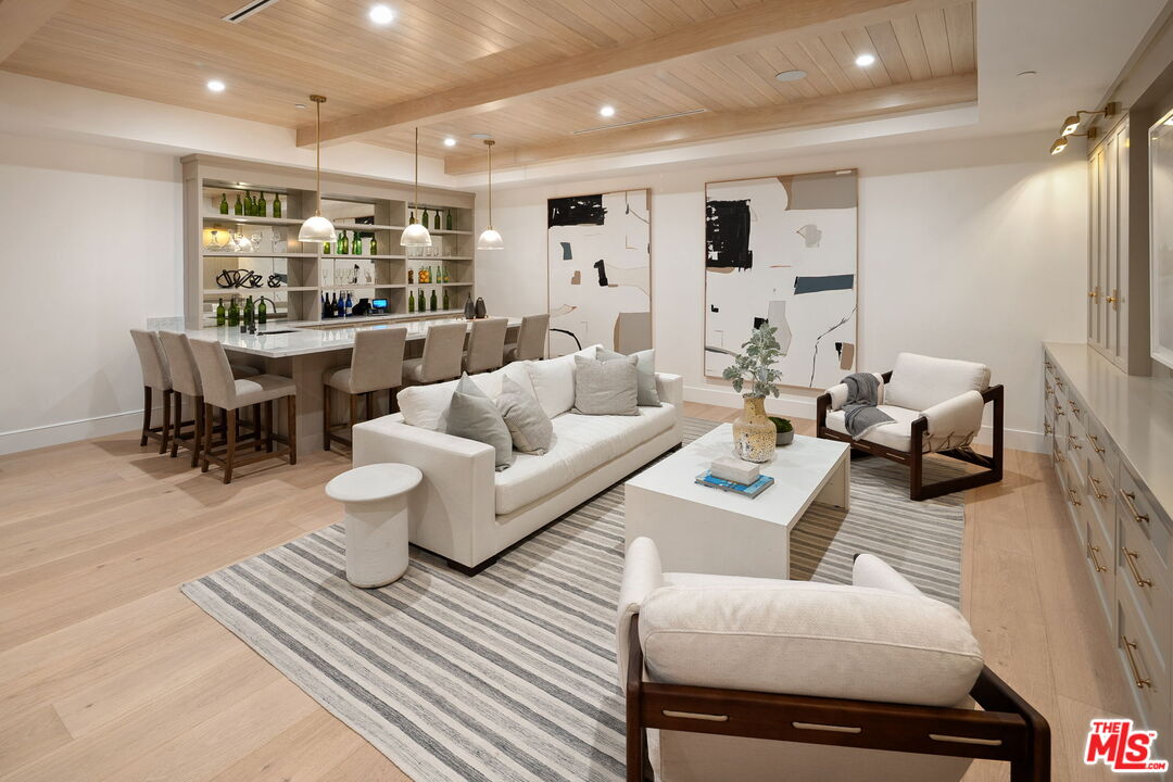 10444 Charing Cross Road Los Angeles, CA 90024 - Photo 47 of 74 a living room with furniture and view of kitchen