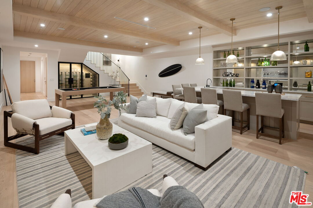 10444 Charing Cross Road Los Angeles, CA 90024 - Photo 49 of 74 a living room with furniture and a wooden floor