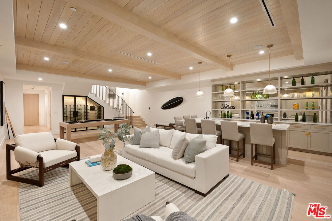 10444 Charing Cross Road Los Angeles, CA 90024 - Photo 50 of 74 a living room with lots of furniture and view of kitchen
