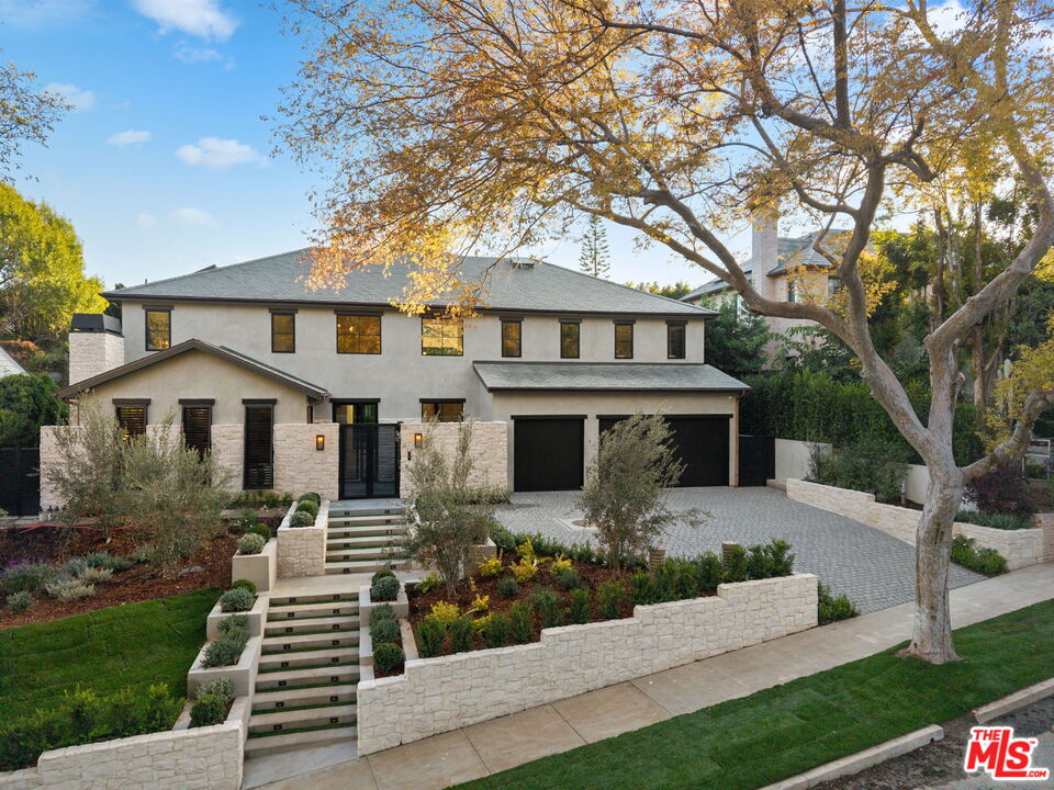 10444 Charing Cross Road Los Angeles, CA 90024 - Photo 5 of 74 a front view of a house with yard and green space