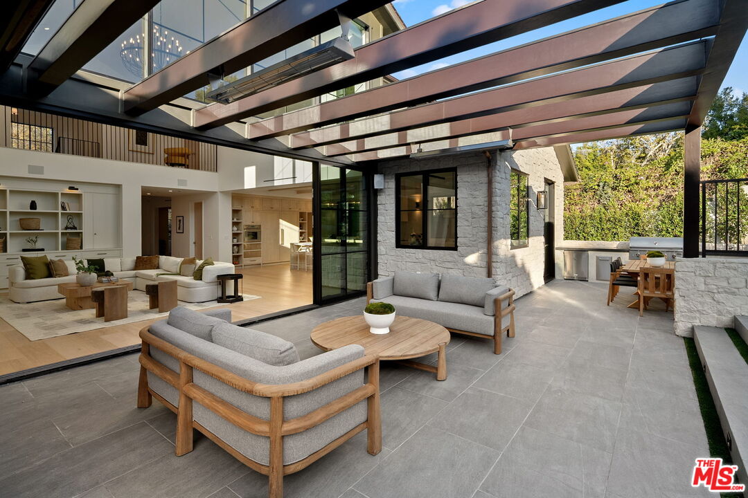10444 Charing Cross Road Los Angeles, CA 90024 - Photo 58 of 74 a living room with furniture and a large window