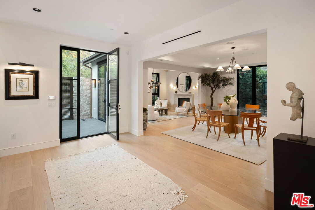 10444 Charing Cross Road Los Angeles, CA 90024 - Photo 6 of 74 a view of a livingroom with furniture and tables in room