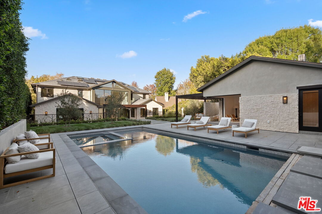 10444 Charing Cross Road Los Angeles, CA 90024 - Photo 64 of 74 a view of a patio with swimming pool table and chairs