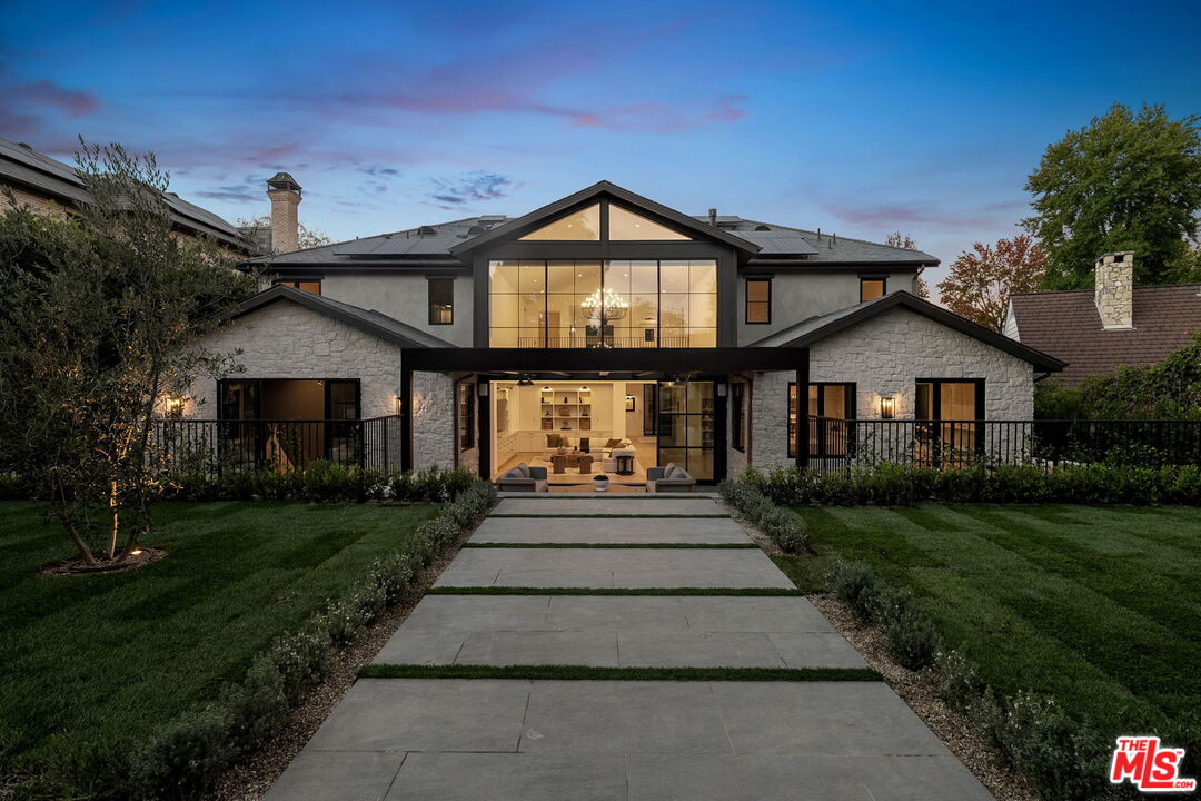 10444 Charing Cross Road Los Angeles, CA 90024 - Photo 71 of 74 a front view of a house with a yard
