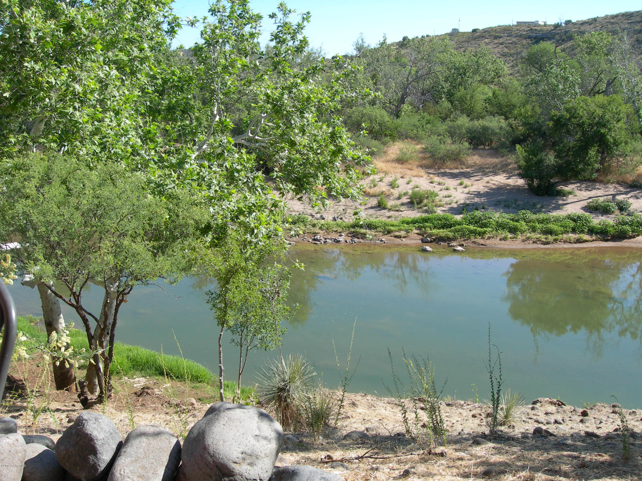 0 Reay Road Rimrock, AZ 86335 - Photo 3 of 12 a view of a lake with a yard