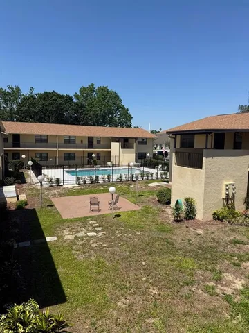 a view of house with yard