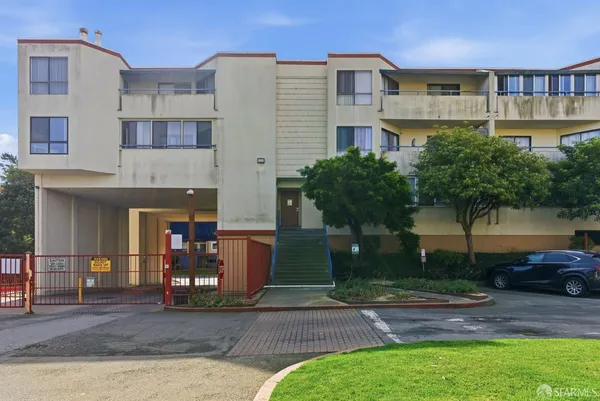 a front view of a building with garden