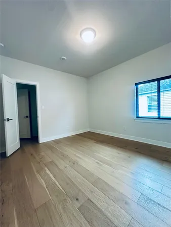an empty room with a empty space and windows