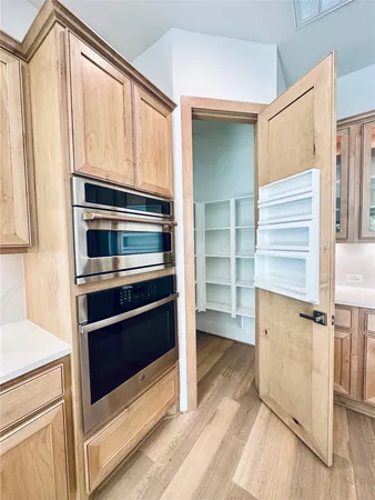 a kitchen with a refrigerator and countertop