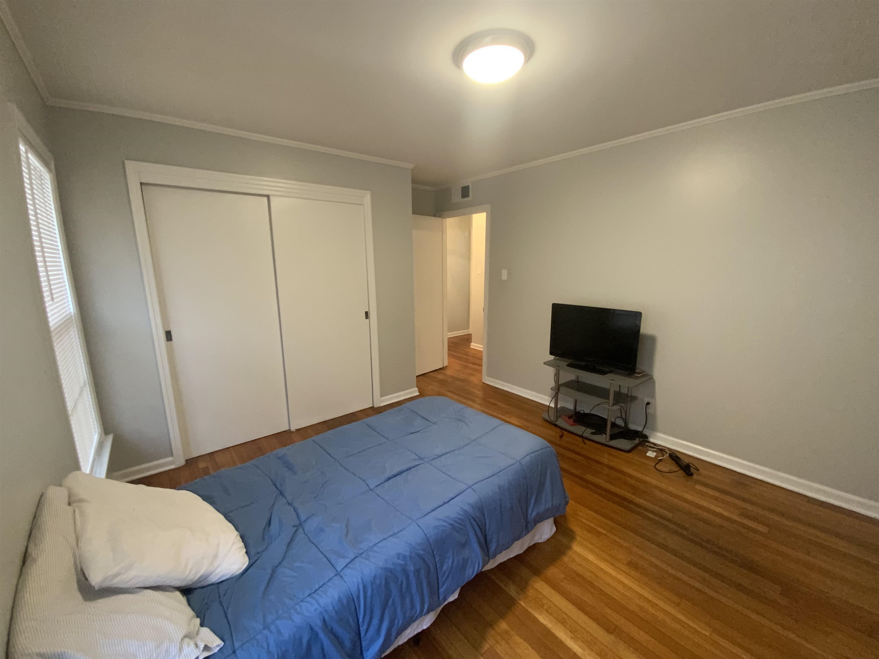 2965 Falkirk Road Memphis, TN 38128 - Photo 11 of 27 a bedroom with a bed and a flat screen tv