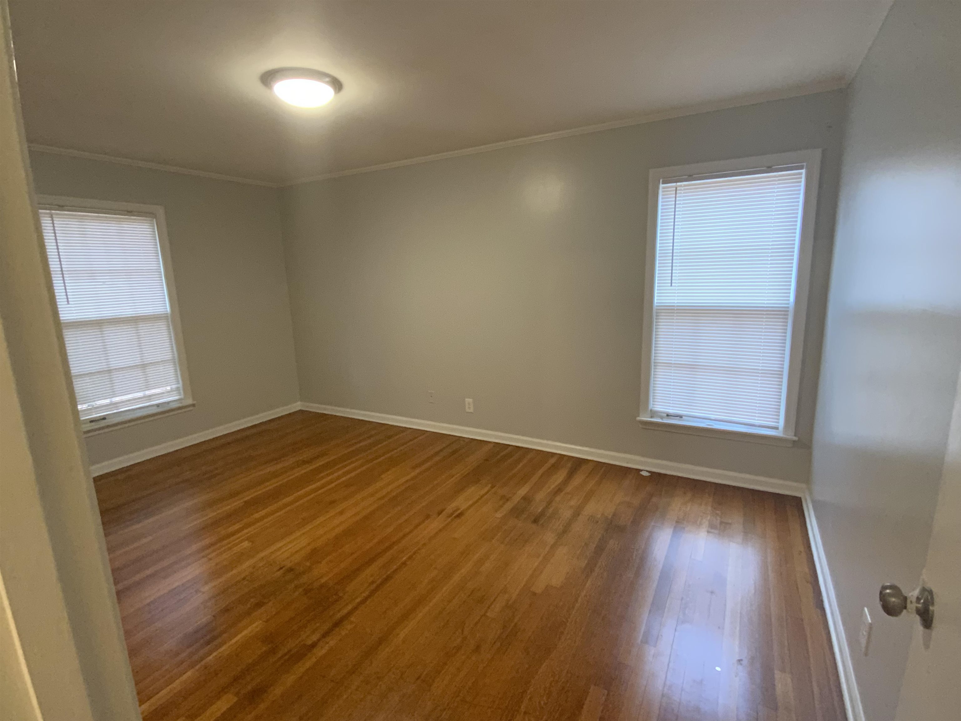 2965 Falkirk Road Memphis, TN 38128 - Photo 12 of 27 a view of empty room with wooden floor and fan