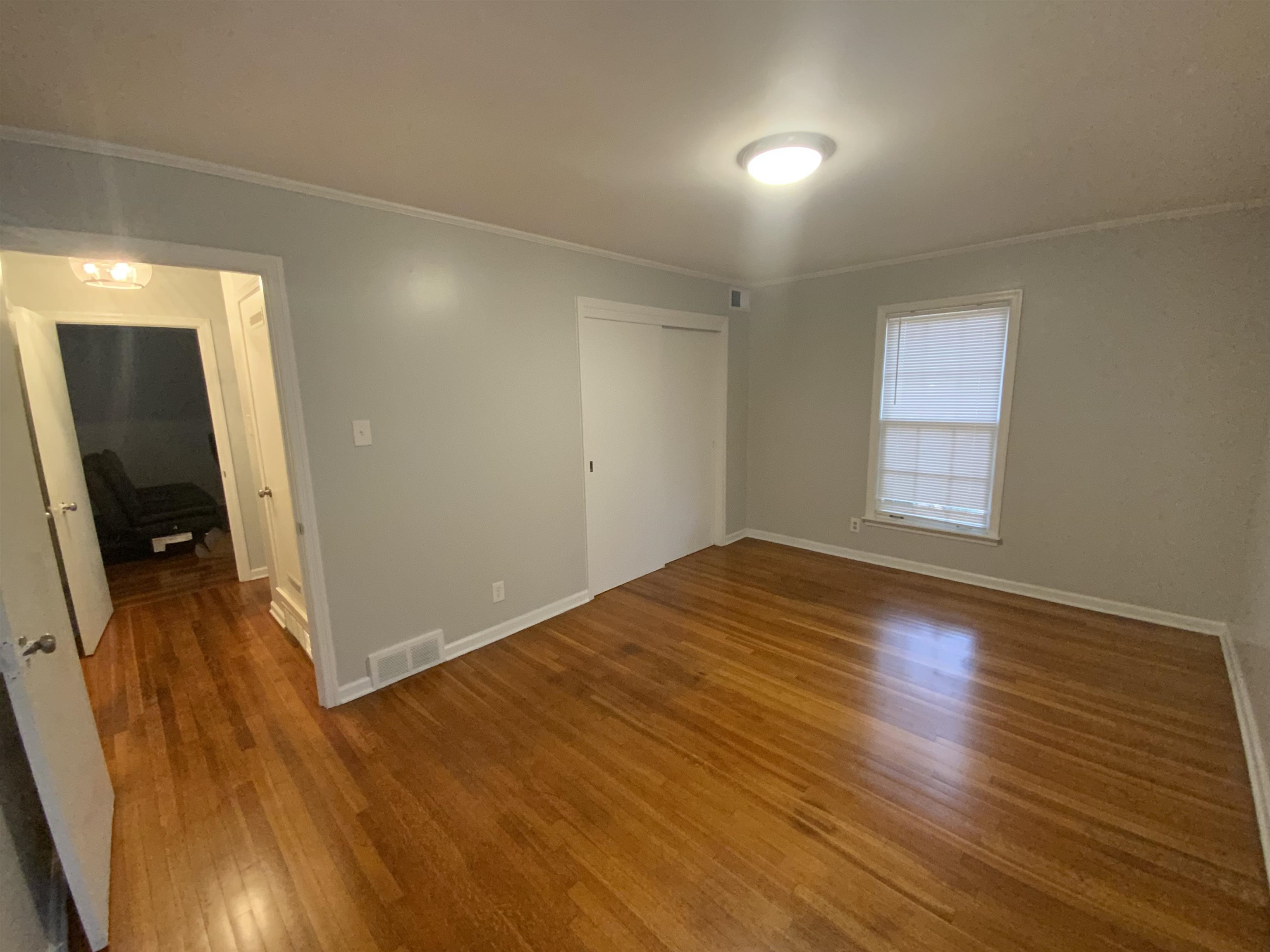 2965 Falkirk Road Memphis, TN 38128 - Photo 13 of 27 wooden floor in an empty room