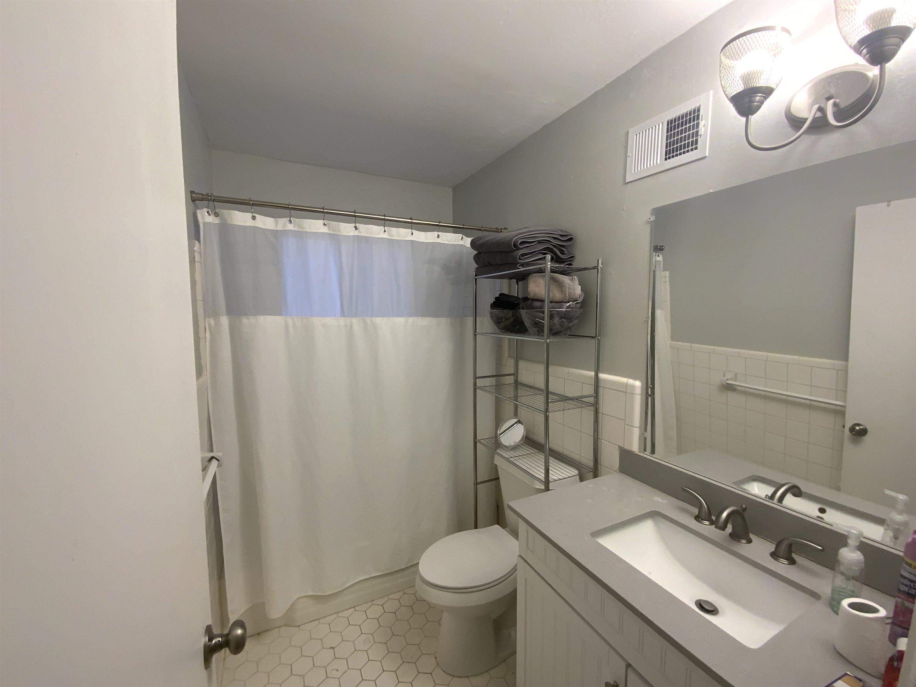 2965 Falkirk Road Memphis, TN 38128 - Photo 17 of 27 a bathroom with a granite countertop sink toilet and shower