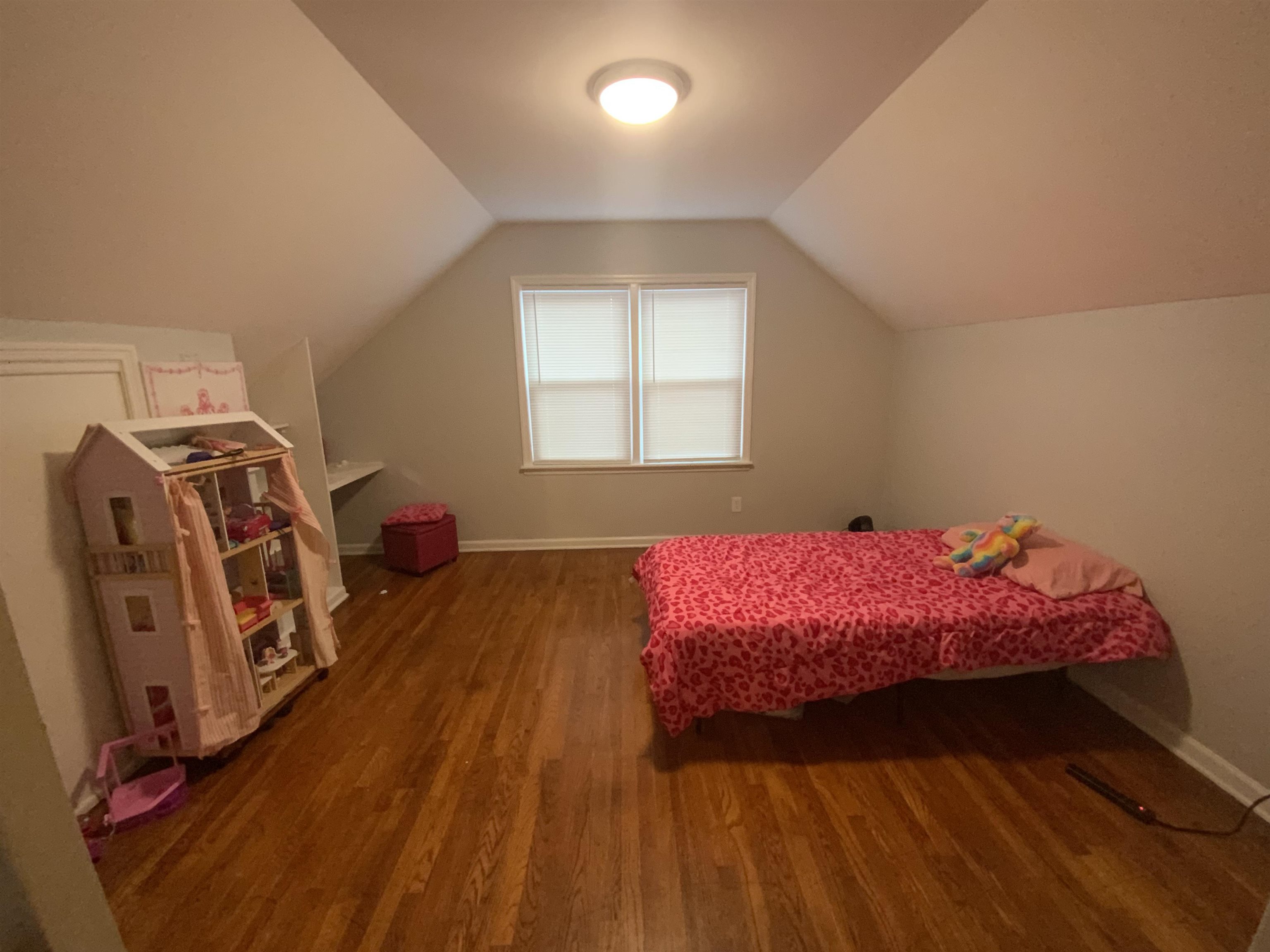 2965 Falkirk Road Memphis, TN 38128 - Photo 20 of 27 a bedroom with a bed and wooden floor