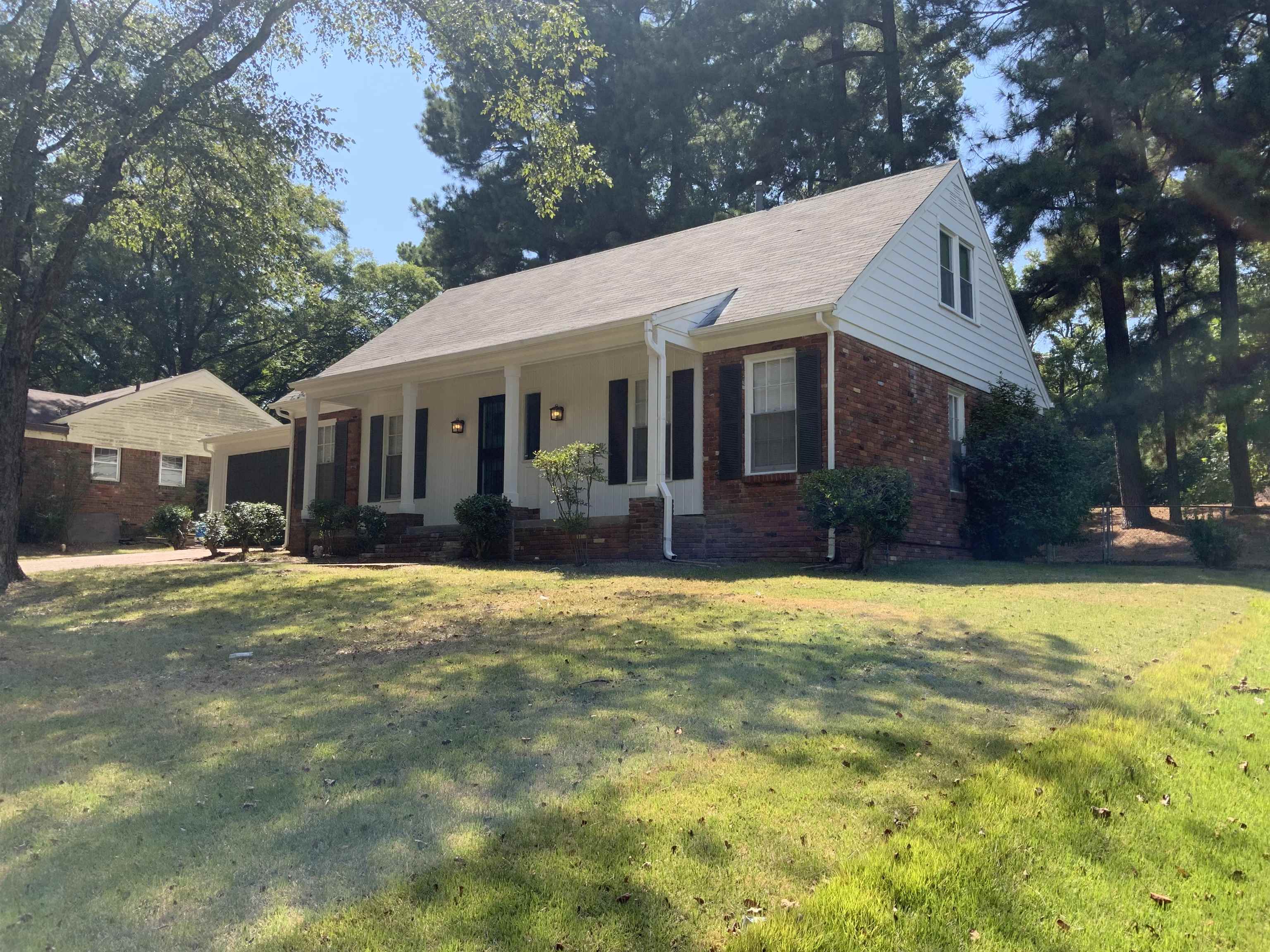 2965 Falkirk Road Memphis, TN 38128 - Photo 24 of 27 a front view of a house with a garden