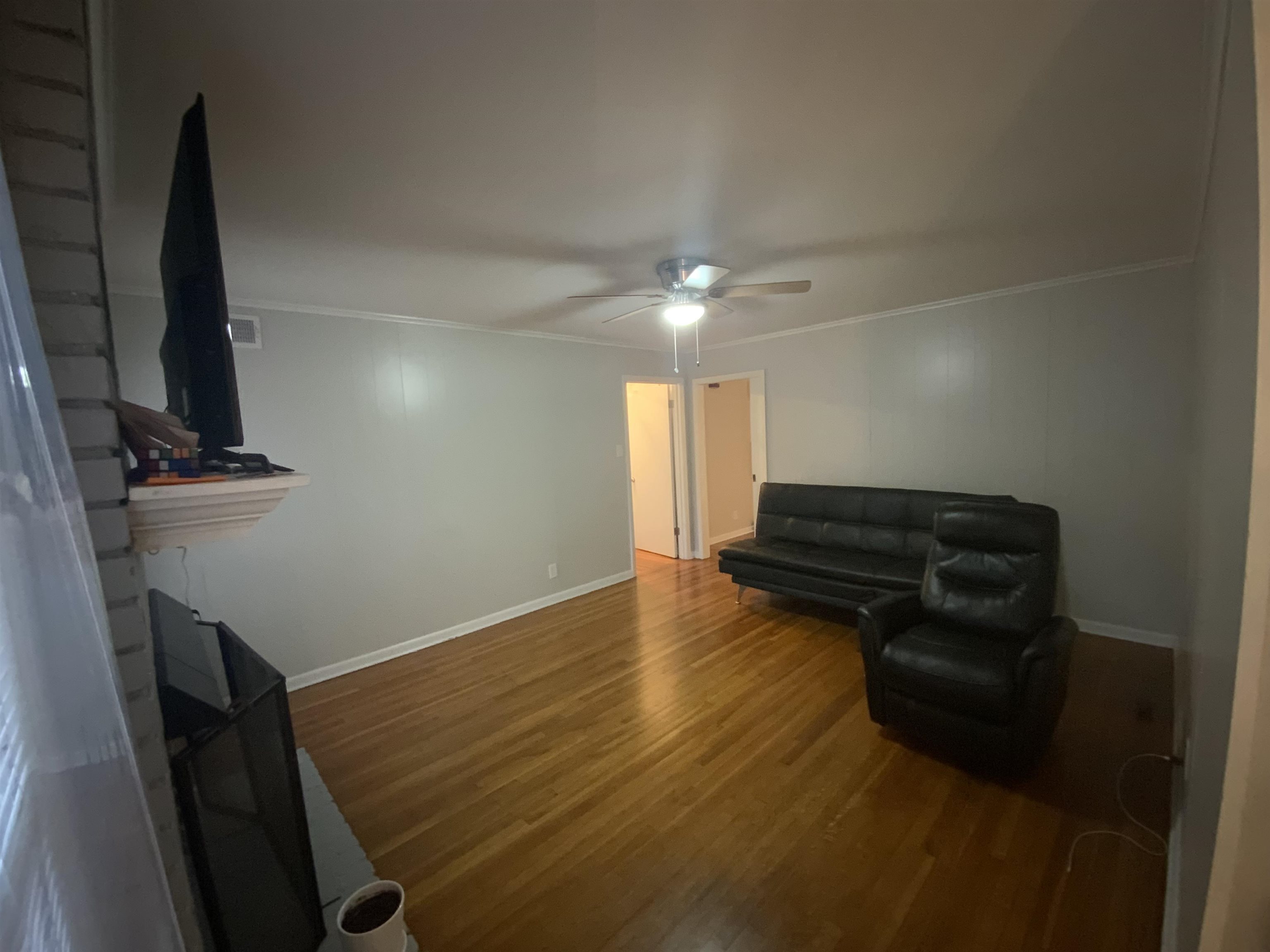 2965 Falkirk Road Memphis, TN 38128 - Photo 6 of 27 a room with a piano and wooden floor