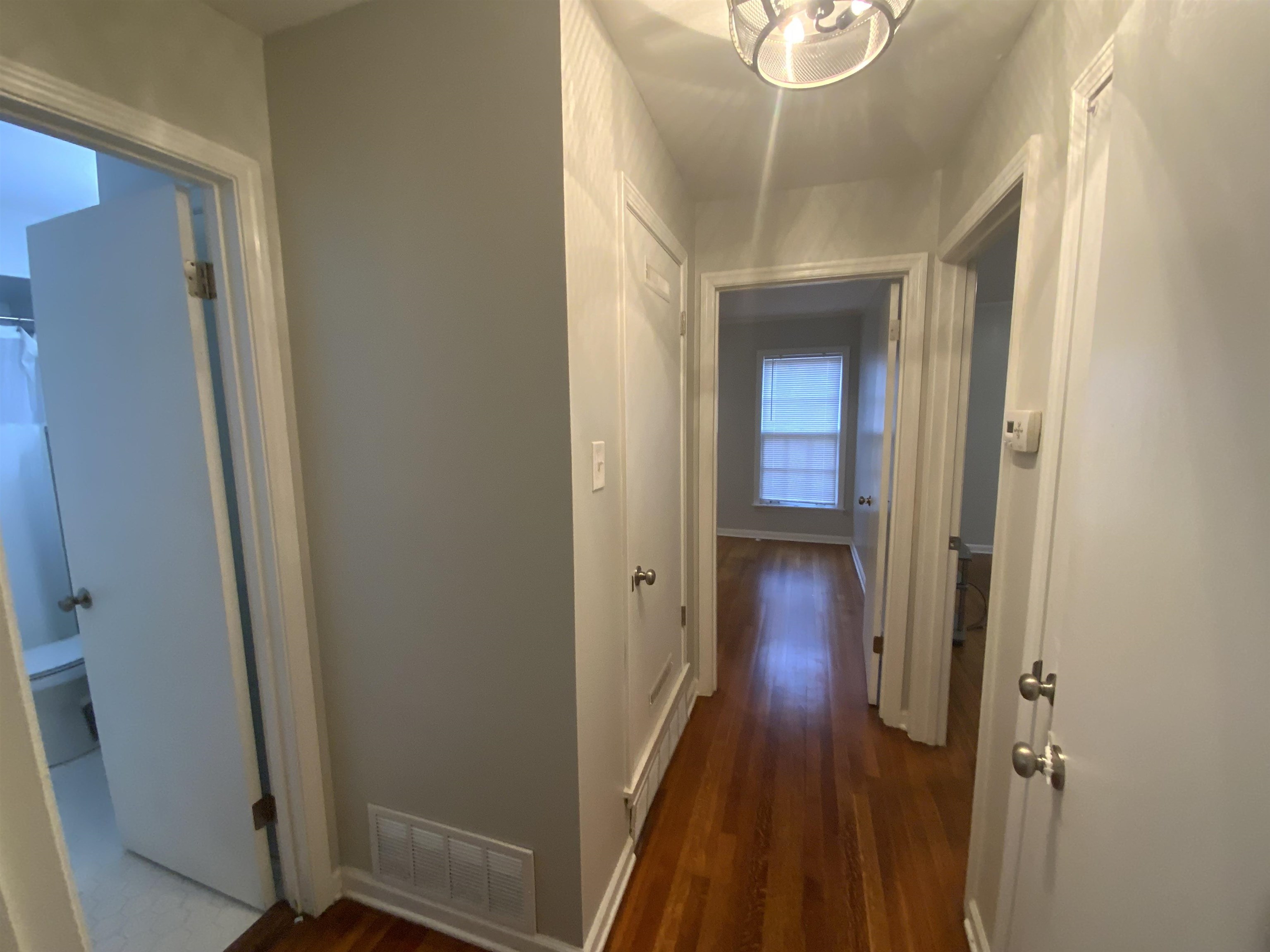 2965 Falkirk Road Memphis, TN 38128 - Photo 8 of 27 a view of a hallway with wooden floor and closet