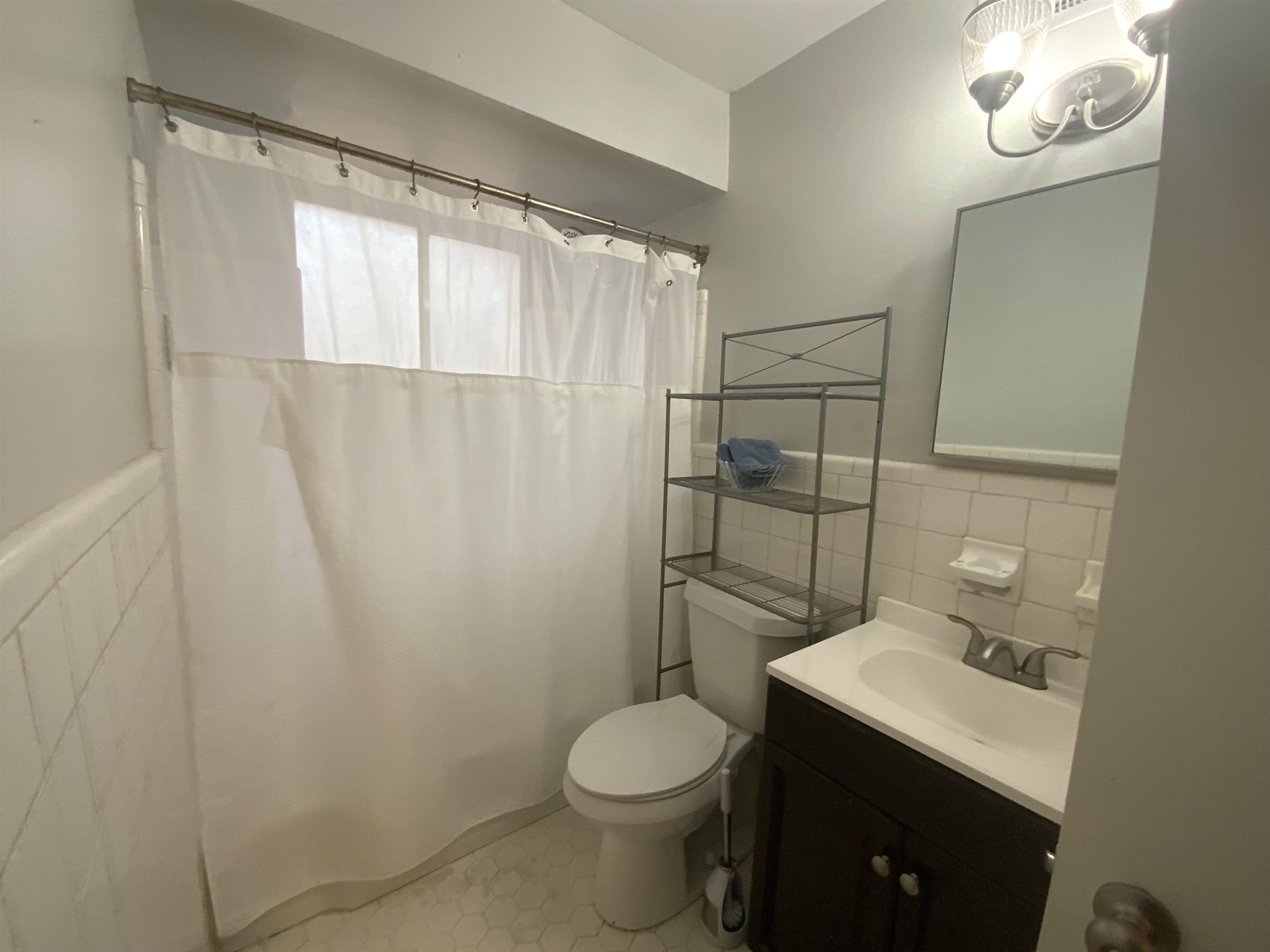 2965 Falkirk Road Memphis, TN 38128 - Photo 9 of 27 a bathroom with a granite countertop toilet sink and shower
