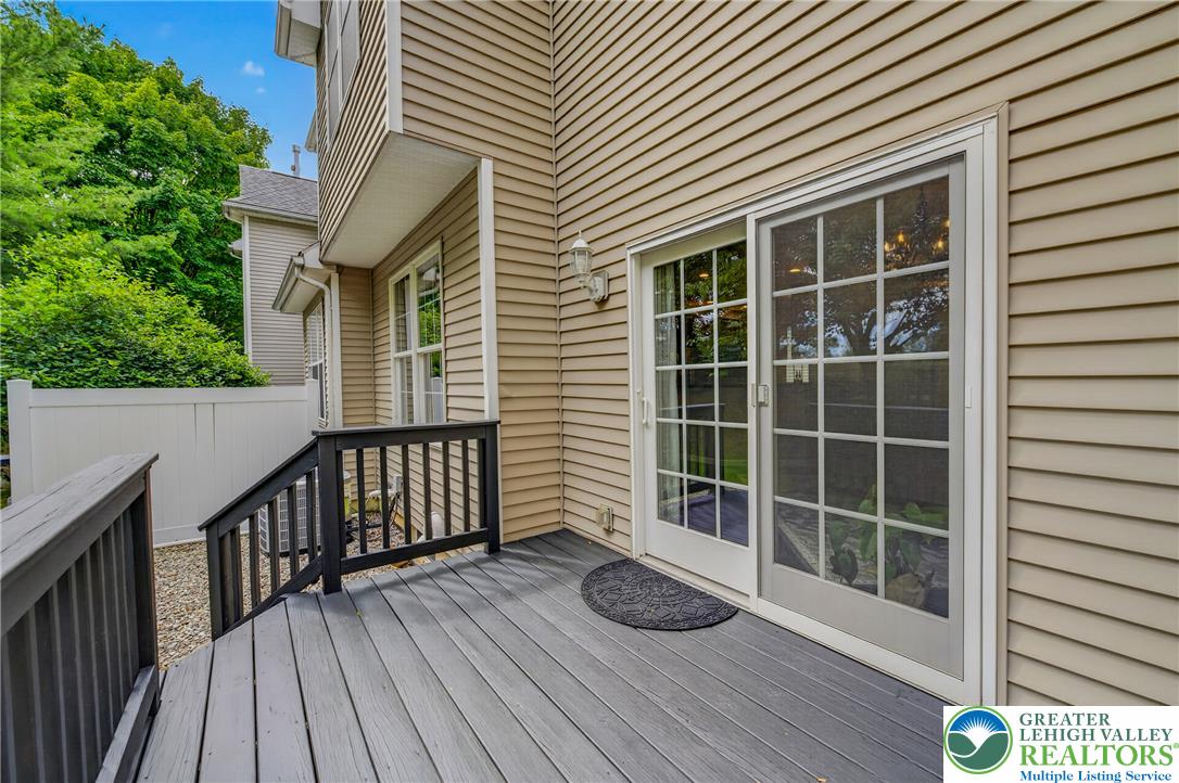 4236 Creek Road Allentown, PA 18104 - Photo 40 of 47 Sliding glass doors open onto a private wooden deck perfect for outdoor relaxation.