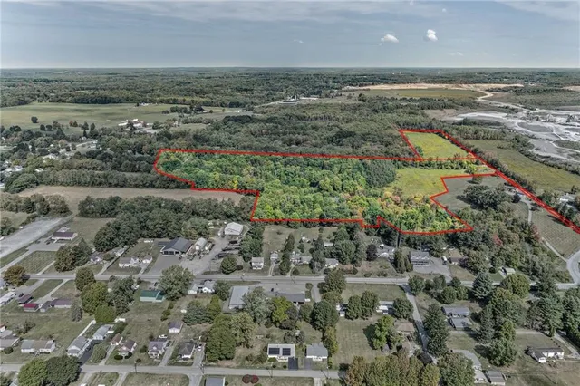 an aerial view of a houses with a yard