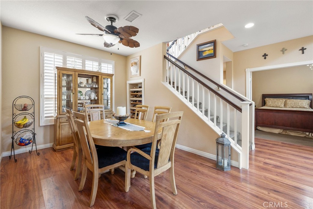17821 Morning Rock Circle Riverside, CA 92503 - Photo 11 of 47 a view of a dining room with furniture window and wooden floor