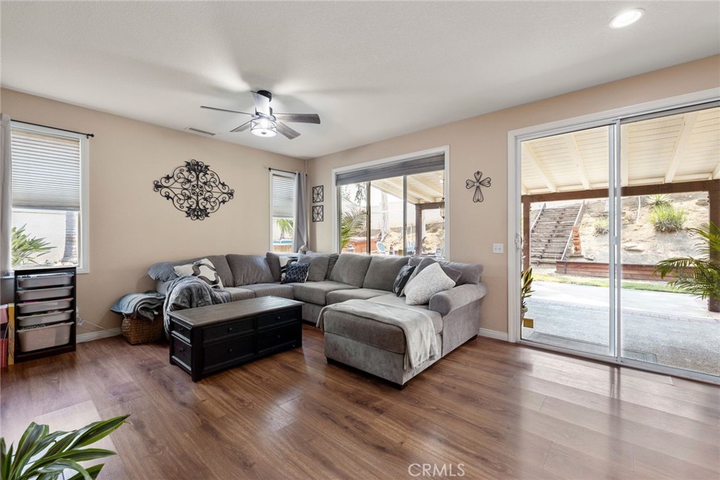 17821 Morning Rock Circle Riverside, CA 92503 - Photo 13 of 47 a living room with furniture and a large window