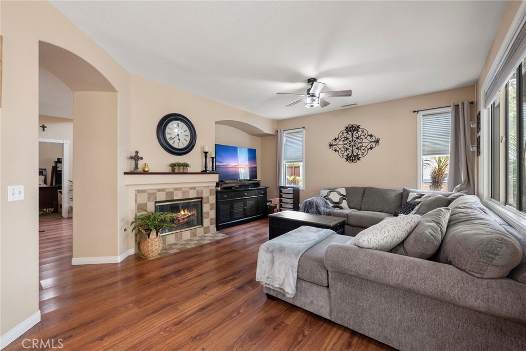 17821 Morning Rock Circle Riverside, CA 92503 - Photo 14 of 47 a living room with furniture a fireplace and wooden floor